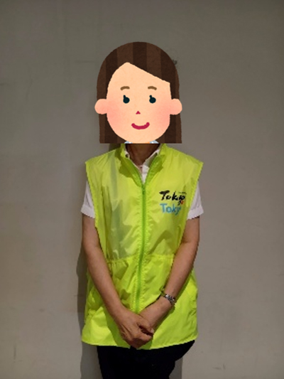 Tour staff member wearing a yellow Tokyo Tokyo uniform